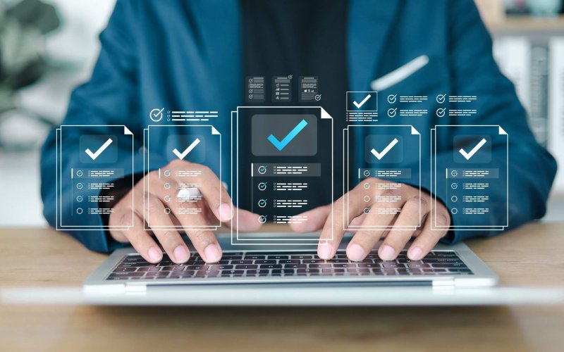 Businessman showing online document validation icon, quality assessment management With a checklist, business document evaluation process.